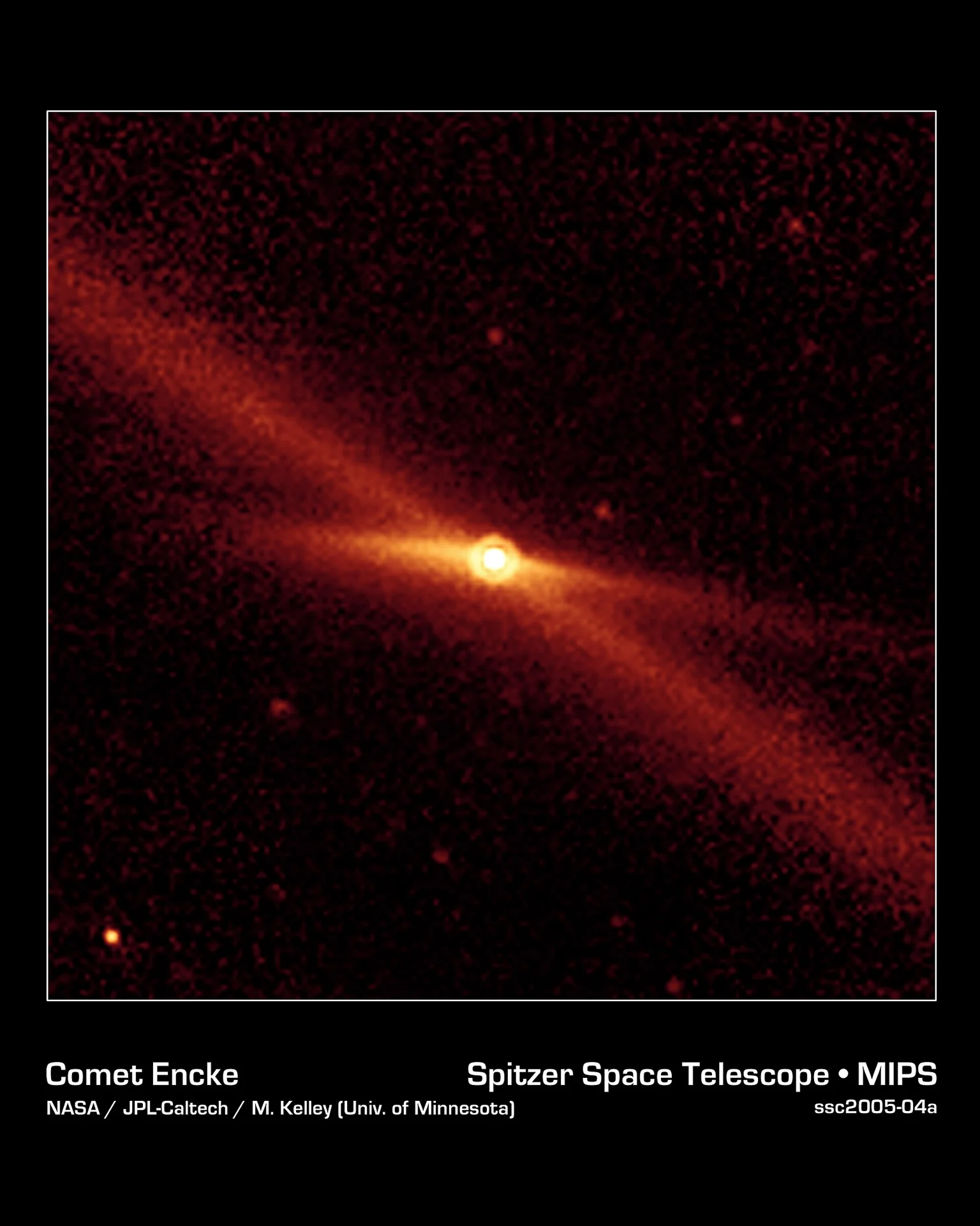 Citra inframerah komet Encke dengan jejak debu memanjang diagonal dari Teleskop Spitzer NASA